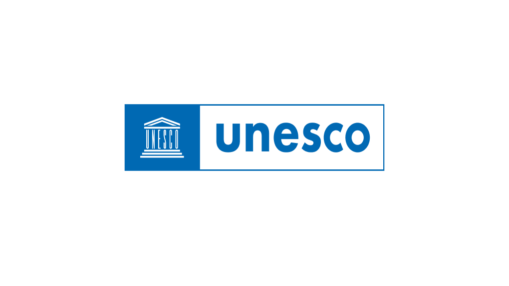 The logo of the United Nations Educational, Scientific and Cultural Organization (UNESCO) features a stylized depiction of a classical temple facade with "UNESCO" written beneath it on the left, set against a blue background, with the word "unesco" in blue lowercase letters on a white background to the right, all enclosed within a blue rectangular border.