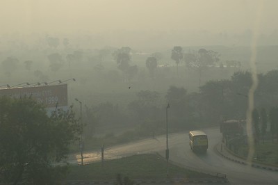 Air pollution covering trees and roads all around