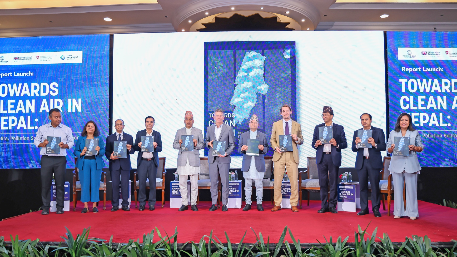 10 people (including 2 females) holding the Report “Towards Clean Air in Nepal: Benefits, Pollution Sources and Solutions” by World bank at launch event held at Hotel Soaltee, on June 17, 2025, in Kathmandu.